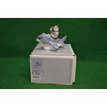 Lladro figure No. 5697 of a young boy flying an aeroplane, with original box - 5.5" tall Please note