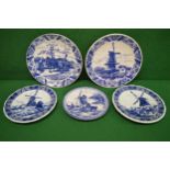 Group of five blue and white 20th century Delft wall plates Please note descriptions are not