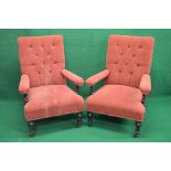 Pair of Victorian open armchairs having padded button backs, padded arms and seats, standing on