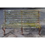 Victorian iron scroll frame garden bench having rear iron wheels and wooden slats - 59.25" long