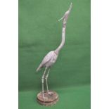 Late 20th century lead statue of a heron standing on circular concrete base - 55" tall Please note