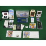 Box of hand held computer games from Nintendo, Systema, Grandstand, Bandai, Hartung-Berlin etc