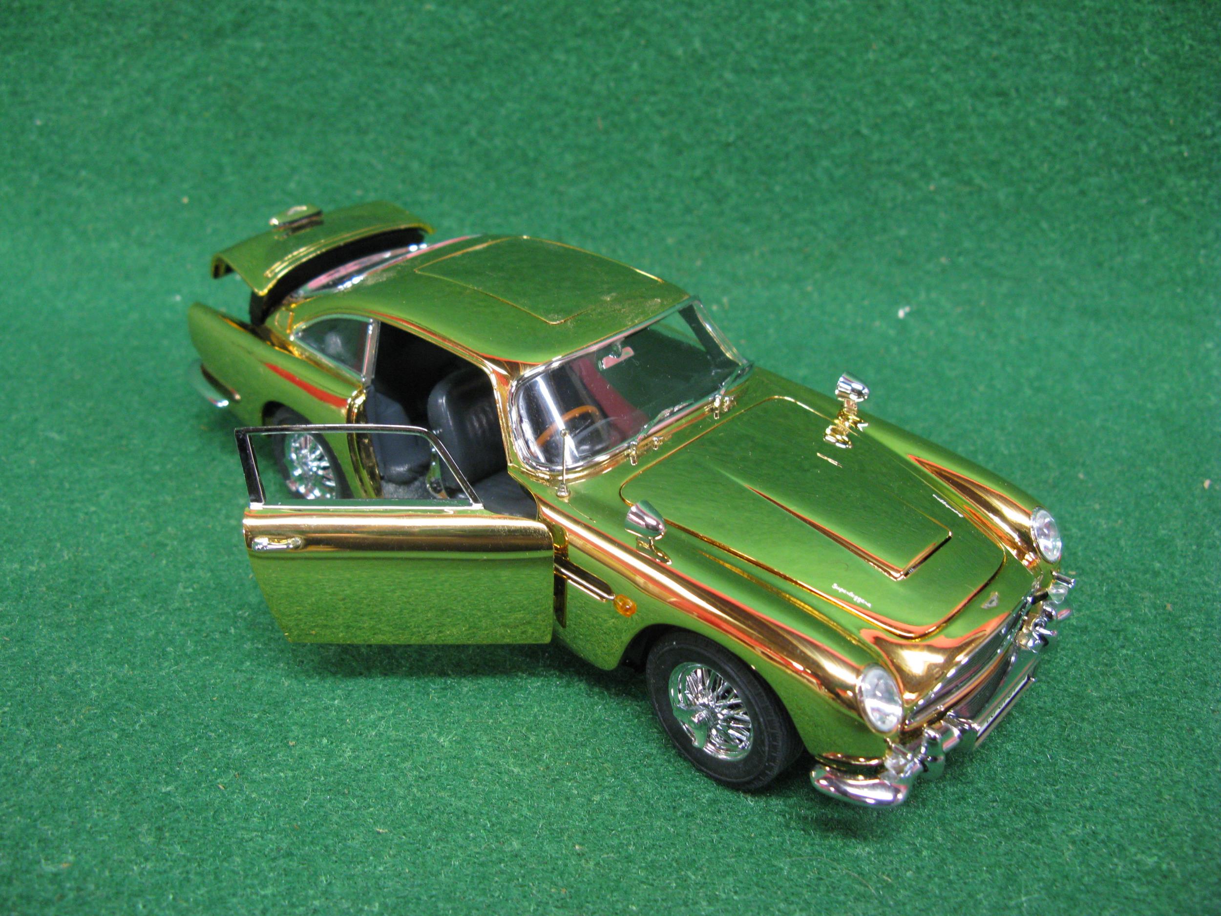 Danbury Mint diecast and plastic model of James Bond's Aston Martin DB5 in gold with many moving - Image 2 of 3