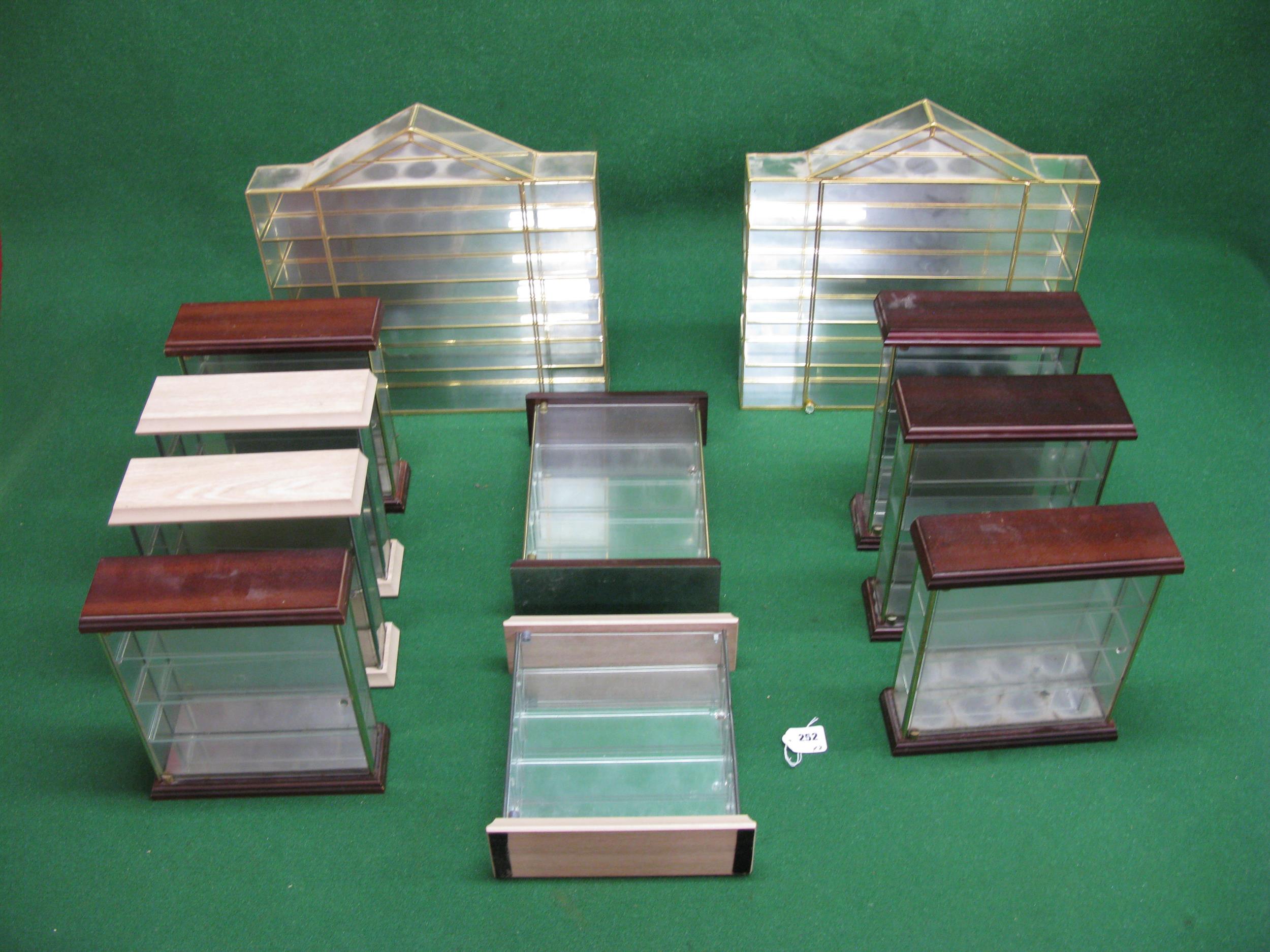 Approx nine small display cabinets with glass sides, opening door and shelves, suitable for military