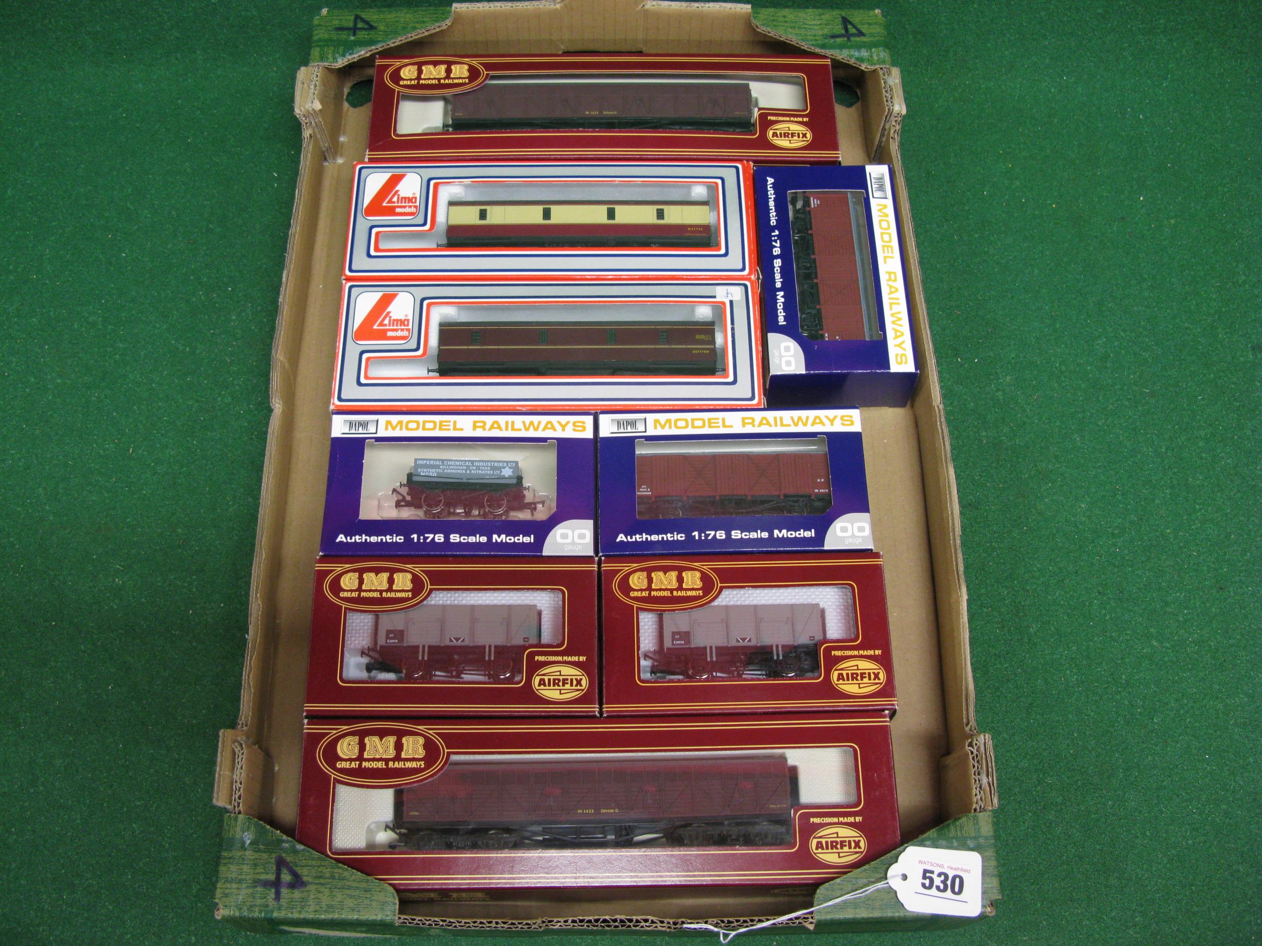 Nine boxed OO bogie and four wheel wagons and baggage vans from Lima, Airfix/GMR and Dapol Please