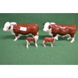 Two Beswick figures of Hereford bulls and two calves Please note descriptions are not condition