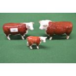 Three Beswick figures of Hereford bull, cow and calf Please note descriptions are not condition