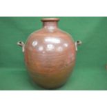 Large copper urn having brass side carrying handles - 26.5" tall Please note descriptions are not
