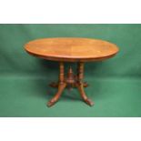 Victorian walnut occasional table having 1/4 veneer oval top with inlaid decoration supported on