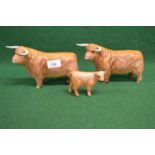 Two Beswick figures of Highland bulls and one calf Please note descriptions are not condition