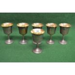 Set of six silver wine goblets having gilt lined bowls supported on plain stems leading to