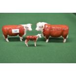 Three Beswick figures of Hereford bull, cow and calf Please note descriptions are not condition