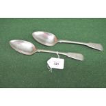 Pair of silver table spoons having Fiddle pattern handles with crest engraving, hallmarked for