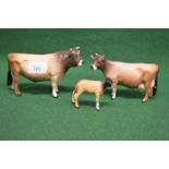 Three Beswick figures of Jersey bull, cow and calf Please note descriptions are not condition