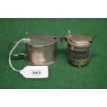 Two silver mustard pots with blue glass liners both hallmarked for Birmingham 1900 and 1918 together
