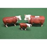 Three Beswick figures of Hereford bull, cow and calf Please note descriptions are not condition