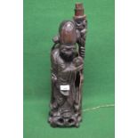 Oriental hardwood figure of a robed man holding a staff with Heron bedside him and wire work