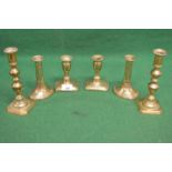 Three pairs of Georgian brass candlesticks of varying sizes Please note descriptions are not