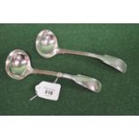 Pair of silver sauce ladles having Fiddle & Thread pattern handles with crest engraving,