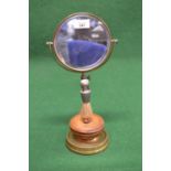 Adjustable brass shaving stand having circular swing mirror and pewter handle brush supported by