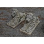 Pair of recumbent lion statues - 32" long x 13" wide Please note descriptions are not condition