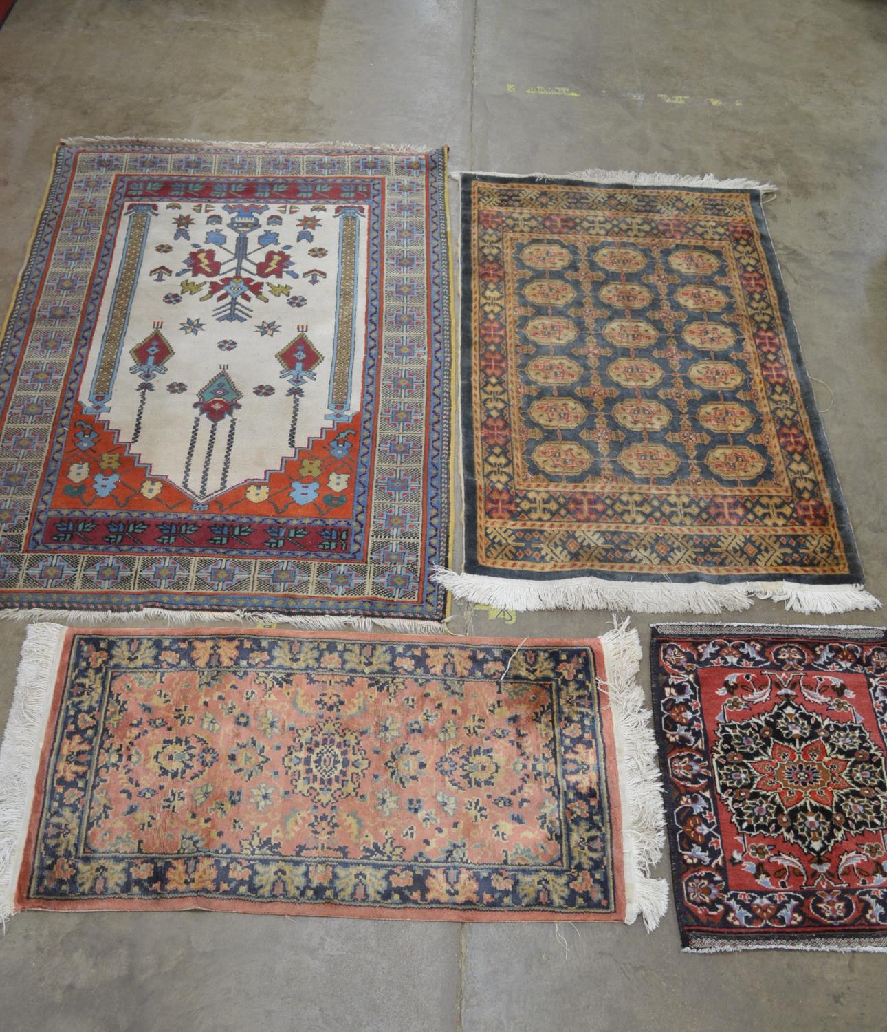 Group of four various rugs Please note descriptions are not condition reports, please request