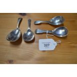 Group of four various silver caddy spoons (2.1ozt) Please note descriptions are not condition