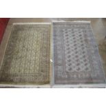 Two green ground rugs with end tassels - 75" x 49" and 80" x 48" Please note descriptions are not
