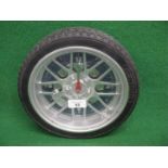 Modern plastic battery wall clock in the form of an alloy wheel and tyre - 10.5" in dia Please