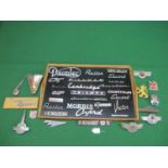 Tray of vehicle manufacturers badges and emblems to include: Victor, Daimler, Morris Oxford,