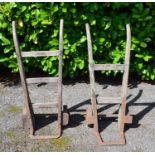 Two wooden sack trollys with iron plates and wheels Please note descriptions are not condition