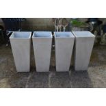 Set of four square plastic planters - 27.75" tall Please note descriptions are not condition