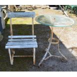 Circular glass top table and single wood and iron chair Please note descriptions are not condition