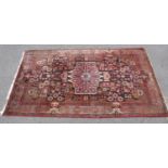 Red and dark blue ground patterned rug with tassels 2.42m x1.5m Please note descriptions are not