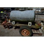 Galvanised water bowser mounted on a trailer frame (wheels siezed) Please note descriptions are