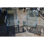 Two green painted metal garden chairs Please note descriptions are not condition reports, please