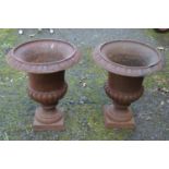 Pair of small late 20th century iron garden urns - 12.25" tall Please note descriptions are not