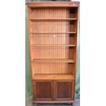 Oak bookshelves having four adjustable shelves over two doors - 37.5" wide x 85" tall Please note