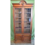 Oak glazed two door bookcase with arched top - 35.75" wide x 81" tall Please note descriptions are