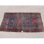 Blue and red ground patterned rug - 2.34m x 1.26m Please note descriptions are not condition