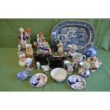 Quantity of ceramics to include: Staffordshire figures, cow cream jugs, blue & white meat plate