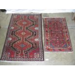 Two red ground patterned rugs - 1.58m x 1.08m and 1.20m x 0.75m Please note descriptions are not