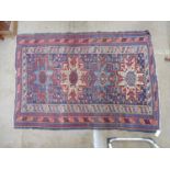 Blue ground rug with blue, cream and red pattern - 1.59m x 1.11m Please note descriptions are not