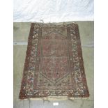 Red ground patterned rug - 1.51m x 1m Please note descriptions are not condition reports, please