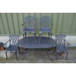 Lazy Susan metal garden table and four elbow chairs Please note descriptions are not condition