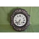 Ebonised wall clock having inlaid decoration and glass dial with black Roman Numerals and pierced