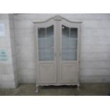 Painted two door glazed cabinet - 44.5" wide Please note descriptions are not condition reports,