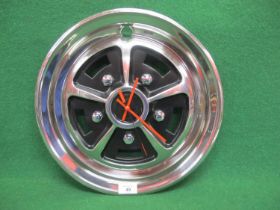 Battery powered bespoke wall clock made with a Rostyle wheel trim Please note descriptions are not