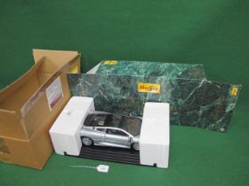 1:12 scale metal and plastic detailed model of a 1992 Jaguar XJ220 with many moving parts, display