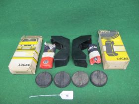 Four Holdite circular (to fit 2.25") pedal rubbers and two boxed Lucas over-rider spot lamp